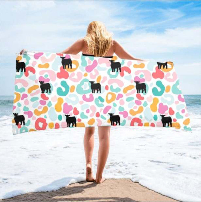 Leopard with black beach towel